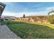 Well-maintained backyard with green lawn, privacy fencing, and ample space for outdoor activities and relaxation at 6130 Pebble Glen, Las Vegas, NV 89149