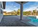 Stunning backyard features a sparkling pool, spa, and expansive patio area, perfect for outdoor entertaining at 6130 Pebble Glen, Las Vegas, NV 89149