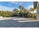 Spacious backyard featuring lush landscaping and a large concrete area at 6130 Pebble Glen, Las Vegas, NV 89149