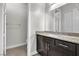 Bright bathroom with a granite countertop, vanity, and tile flooring at 6130 Pebble Glen, Las Vegas, NV 89149