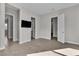 Spacious bedroom featuring neutral walls, tile floors, TV, and closet with shelving at 6130 Pebble Glen, Las Vegas, NV 89149