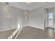 Bedroom with tile floors, modern light fixtures and doors to an outdoor balcony at 6130 Pebble Glen, Las Vegas, NV 89149