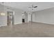 Open bedroom features tile flooring, a ceiling fan, and an ensuite bathroom at 6130 Pebble Glen, Las Vegas, NV 89149