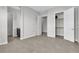 Spacious bedroom featuring tile floors, multiple doors, and generous closet space at 6130 Pebble Glen, Las Vegas, NV 89149