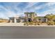 Modern two-story home featuring a three-car garage and professionally landscaped front yard at 6130 Pebble Glen, Las Vegas, NV 89149