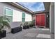 Inviting entrance to home, with a red front door and landscaping at 6130 Pebble Glen, Las Vegas, NV 89149