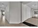 Hallway with tile floors, white trim, and natural light at 6130 Pebble Glen, Las Vegas, NV 89149