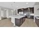 Well-equipped kitchen with a large island, stainless steel appliances, and ample cabinet space at 6130 Pebble Glen, Las Vegas, NV 89149