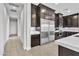 Kitchen features a large stainless fridge and dark wood cabinetry at 6130 Pebble Glen, Las Vegas, NV 89149