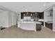 Open-concept kitchen with a center island, dark cabinetry, and stainless steel appliances at 6130 Pebble Glen, Las Vegas, NV 89149