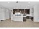 Open concept living room flowing to the kitchen with a breakfast bar at 6130 Pebble Glen, Las Vegas, NV 89149