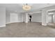 Open living room showing tile floors, neutral paint and access to other rooms in the house at 6130 Pebble Glen, Las Vegas, NV 89149