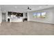 Open concept living room flowing to the kitchen with a breakfast bar at 6130 Pebble Glen, Las Vegas, NV 89149