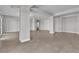 Spacious living room featuring tile floors, neutral paint and access to other rooms at 6130 Pebble Glen, Las Vegas, NV 89149