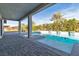 A backyard pool with a clear blue waters and lush tropical landscaping at 6130 Pebble Glen, Las Vegas, NV 89149