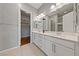 Sleek bathroom featuring a double vanity, modern fixtures, and a walk-in closet at 6192 Lautman Ridge Ct, Las Vegas, NV 89141