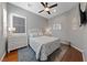 Cozy bedroom featuring a queen bed, soft rug, and a white dresser illuminated by a bedside lamp at 6192 Lautman Ridge Ct, Las Vegas, NV 89141