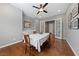 Spacious dining room featuring wood floors, classic French doors, and modern ceiling fan at 6192 Lautman Ridge Ct, Las Vegas, NV 89141
