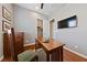 Comfortable office with hardwood floors, natural light, and TV at 6192 Lautman Ridge Ct, Las Vegas, NV 89141
