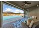 Relaxing outdoor space with a pool view, covered patio with plush seating and a decorative rug at 6192 Lautman Ridge Ct, Las Vegas, NV 89141