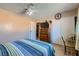 This bedroom features neutral walls, carpet, ceiling fan, and built-in closet at 6312 Portola Rd, Las Vegas, NV 89108