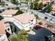 Aerial view of a multi-level home with a red-tiled roof, convenient parking, and neat landscaping at 650 Sandy Beach Way # 0, Boulder City, NV 89005