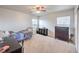 Bedroom with carpet flooring, ceiling fan and windows at 6736 Sugarbird Ct, North Las Vegas, NV 89084