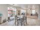 Bright dining area features sliding glass doors to the backyard, and is adjacent to an office/den area at 6736 Sugarbird Ct, North Las Vegas, NV 89084