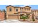 Inviting two-story home with a well-manicured lawn and a two-car garage at 6736 Sugarbird Ct, North Las Vegas, NV 89084