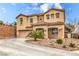 Beautiful two-story home featuring a lush front yard with desert landscaping at 6736 Sugarbird Ct, North Las Vegas, NV 89084