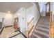Inviting foyer features tiled flooring and a staircase leading to the upper level at 6736 Sugarbird Ct, North Las Vegas, NV 89084