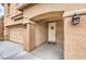Inviting front entrance with a decorative wreath and stylish exterior lighting at 6736 Sugarbird Ct, North Las Vegas, NV 89084