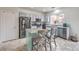 Modern kitchen features stainless steel appliances, granite countertops, and a functional center island at 6736 Sugarbird Ct, North Las Vegas, NV 89084