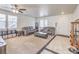 Spacious living room with comfortable seating, plush carpet, and stylish decor at 6736 Sugarbird Ct, North Las Vegas, NV 89084