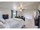 Expansive main bedroom features plush carpeting, ample closet space, and a ceiling fan at 6736 Sugarbird Ct, North Las Vegas, NV 89084