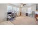 Bright office space with a large window, built-in shelving, and a comfortable workspace at 6736 Sugarbird Ct, North Las Vegas, NV 89084