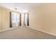 Cozy bedroom featuring neutral walls, carpeted floors, and natural light from the windows at 6741 Philippe Allen Ave, Las Vegas, NV 89110