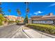 Elegant community entrance to Hollywood Heights featuring lush landscaping and a grand stone sign at 6741 Philippe Allen Ave, Las Vegas, NV 89110