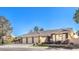 Beautiful single-story house showing a 3-car garage and mature desert landscaping at 6741 Philippe Allen Ave, Las Vegas, NV 89110