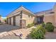 Single-story home featuring a 3-car garage, stone accents, and desert landscaping at 6741 Philippe Allen Ave, Las Vegas, NV 89110