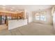 Open-concept kitchen featuring stainless steel appliances, a breakfast bar, and natural light at 6741 Philippe Allen Ave, Las Vegas, NV 89110