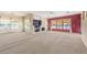 Expansive open living area with large windows, a fireplace, and neutral color scheme at 6741 Philippe Allen Ave, Las Vegas, NV 89110