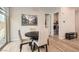 Bright dining area features wood floors and access to outdoor patio and laundry room at 758 Marigold Sunrise St, Henderson, NV 89011