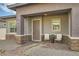 Charming home with a covered porch and a well-maintained, low-maintenance front yard at 758 Marigold Sunrise St, Henderson, NV 89011