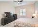 Cozy main bedroom featuring soft carpet, large window, and modern furnishings at 758 Marigold Sunrise St, Henderson, NV 89011