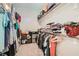 Spacious walk-in closet with ample storage, multiple shelves and hanging rods at 758 Marigold Sunrise St, Henderson, NV 89011