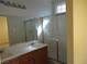 Bathroom featuring double sinks, a mirror, and a walk-in shower at 7929 Palace Monaco Ave, Las Vegas, NV 89117