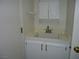 Bathroom features a basic sink with white cabinets and brushed gold hardware at 7929 Palace Monaco Ave, Las Vegas, NV 89117