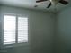 Bedroom featuring wood floors, natural lighting, and a ceiling fan at 7929 Palace Monaco Ave, Las Vegas, NV 89117