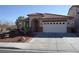 Charming single-story home with a well-manicured front yard and tile roof at 7929 Palace Monaco Ave, Las Vegas, NV 89117